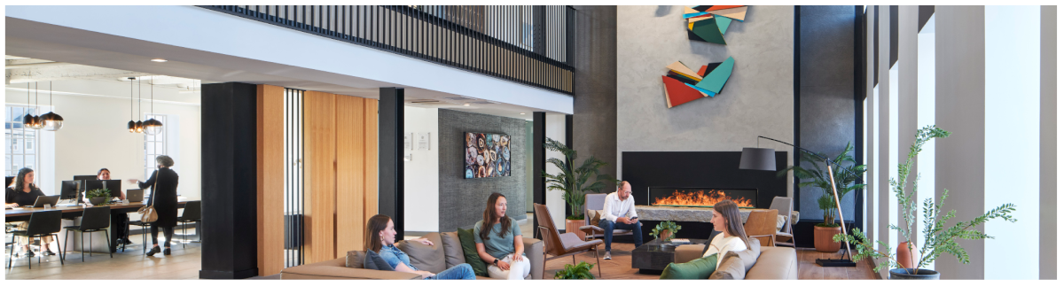 people gathered in an office lobby, as well as a meeting room